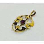 An Art Nouveau 9 ct gold pendant set with amethysts