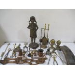 A collection of brass and copper items along with naively carved love spoons