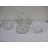 A collection of crystal glass bowls and cut glass