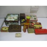 A collection of vintage tins, along with a cigarette case and wooden box etc