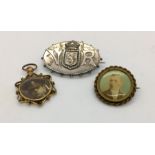 A Victorian hallmarked silver mourning brooch marked VR with the Swiss emblem along with a gold