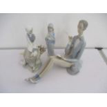 Two Lladro figures of ladies (one missing a bird) along with a Lladro style figure of a gent