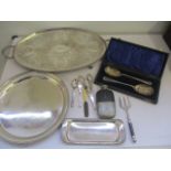 A collection of silver plated items including a muffin fork and grape scissors etc