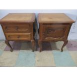 A pair of oak French bedside cabinets