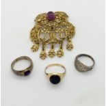 A 9 ct gold ring set with onyx (2.3g) along with two silver rings and a costume jewellery brooch