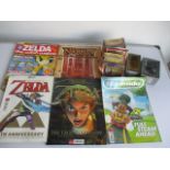 A collection of miscellaneous items including Marvel figures, Zelda magazines, Nintendo Magazines,