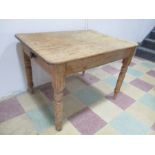 A pine farmhouse table with single drawer