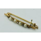 A gold brooch set with diamonds and seed pearls ( carat indistinct)