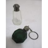A green cut glass perfume bottle along with a silver topped bottle