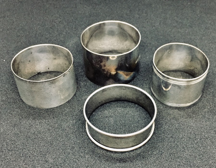 Four hallmarked silver serviette rings