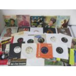 A collection of 7" singles and demos including Elvis Presley, David Bowie, Debbie Harry, The