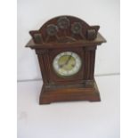 A wooden bracket clock