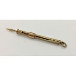 A 9 ct gold telescopic toothpick, 3g