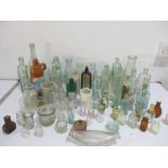 A collection of vintage bottles and jars