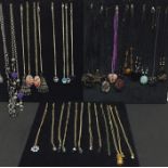 A collection of assorted necklaces including glass pendants