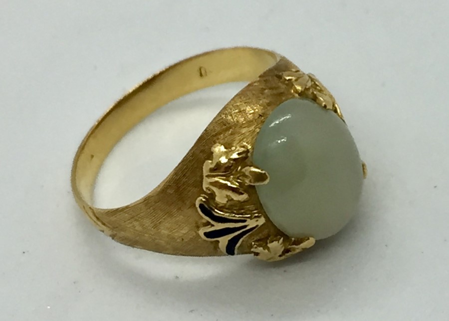 A gold ( hallmark badly rubbed) ring set with jade