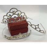 Three tiaras set with crystals