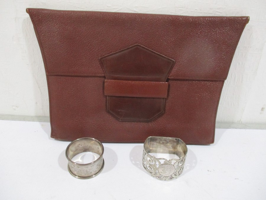 Two hallmarked silver serviette rings along with a vintage purse