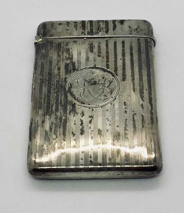A hallmarked silver card case