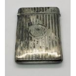 A hallmarked silver card case