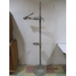 A cast iron bicycle repair stand supplied by The Battery Cycle Works, Plymouth A/F