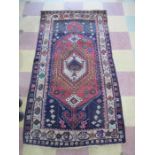 A blue ground Shiraz rug