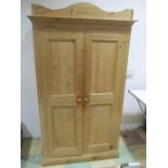 A pine two door wardrobe