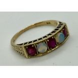 A 9ct gold ruby and opal 5 stone ring