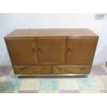 An Ercol sideboard with two drawers under