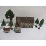 A pre war German wood and card Heinrichsen Figuren farmhouse and outbuilding, treehouse and trees