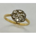 An 18ct gold petal design ring with 7 diamonds