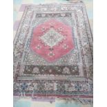 A pink ground Turkish rug