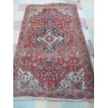 A red ground Eastern rug