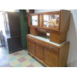 A French art-deco kitchen unit with mirrored doors, drop down front with original glass containers