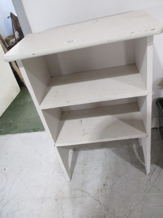 A painted freestanding shelf unit