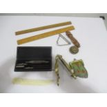 A collection of small items including whistle, chain purse, ivory letter opener, brass nut