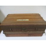 A vintage wooden bound cabin trunk