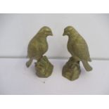 A pair of brass eagle figures