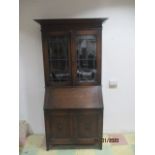 An oak bureau bookcase with leaded light feature