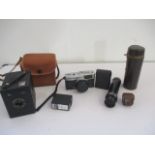 An Olympus Trip 35 camera along with a Popular Brownie etc