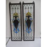 A pair of narrow stain glassed panels (1 has crack)