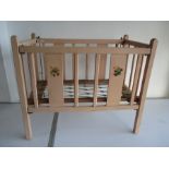 A vintage Tri-Ang dolls cot