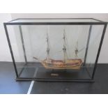 A model ship of "HMS Atalanta" built by Dennis Lewis in wooden case.