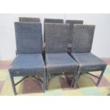 A set of six vintage wicker dining chairs