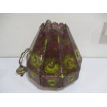 An Arts & Crafts glass lamp shade in green and purple