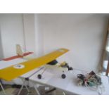 A large Falcon RC plane with accessories