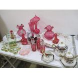 A collection of cranberry glassware, Noritake, meat plates etc on 2 shelves