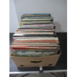 A collection of vinyl records including The Shadows, Tom Jones, Rod Stewart, Mike Oldfield,