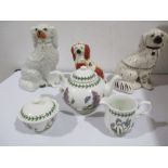 A Portmerion tea pot, sugar and milk jug "Botanic gardens" along with three Staffordshire dogs