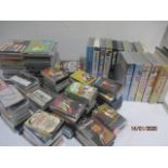 A collection of various CDs, tapes and videos